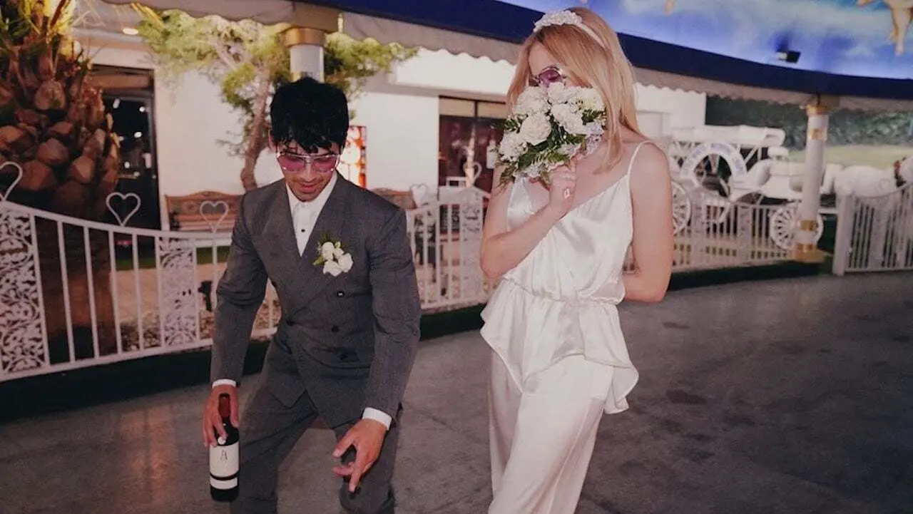 Sophie Turner
Sophie Turner, then 23, walked down the aisle at A Little White Wedding Chapel in Las Vegas wearing a $648 ivory silk Bevza jumpsuit with a killer veil. Vows were exchanged. Ring Pops were involved. Diplo was there Sophie Turner
Sophie Turner, then 23, walked down the aisle at A Little White Wedding Chapel in Las Vegas wearing a $648 ivory silk Bevza jumpsuit with a killer veil. Vows were exchanged. Ring Pops were involved. Diplo was there